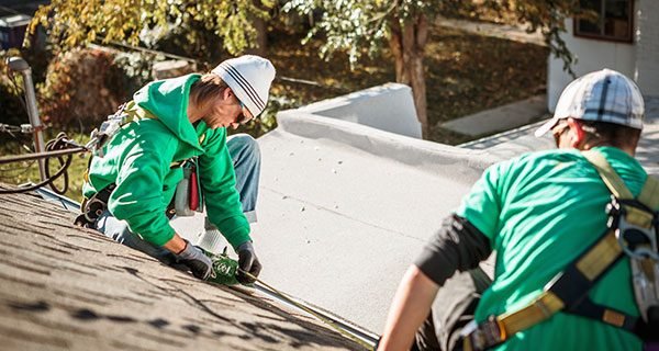 solar-panel-installation-crew-members-on-roof-of-h-2024-11-03-04-48-58-utc